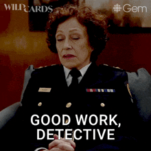 a woman sitting in a chair with the words good work detective on the bottom