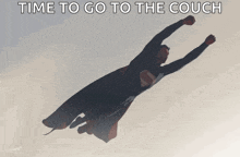 superman is flying through the air with the words time to go to the couch behind him