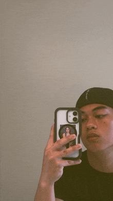 a person taking a picture of themselves in a mirror