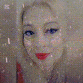 a close up of a woman 's face behind a building