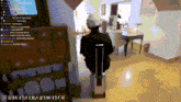 a pixelated image of a man sitting in a chair with a suitcase in front of a screen that says digitalnaswitch on it