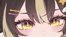 a close up of a girl 's eye with a star on her hair