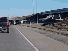 a row of cars are parked on the side of a road