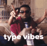 a man wearing sunglasses is sitting on a couch with the words type vibes written above him
