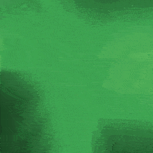 a white circle with a green circle inside of it on a black background