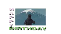 a happy birthday card with a picture of a mountain and a monster