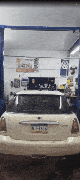 a white mini cooper with a new york license plate