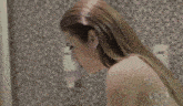 a close up of a woman 's head with a veil on it .