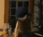 a blurry picture of a person in a blue hat