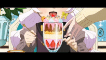 a girl is eating a sundae with strawberries in it