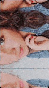 a woman with red nails and a ring on her finger is laying down