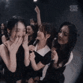 a group of girls are standing in a dark room with the words che che on the bottom