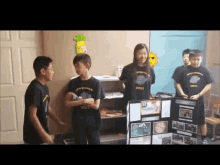 a group of children wearing black shirts with the numbers 31021 on them