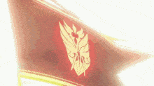 a red flag with a yellow emblem on it