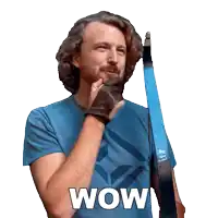 a man in a blue shirt holds a bow with the word wow written on it