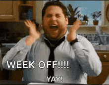a man in a tie is screaming in a kitchen with his hands in the air and the words `` week off !!! yay ! ''