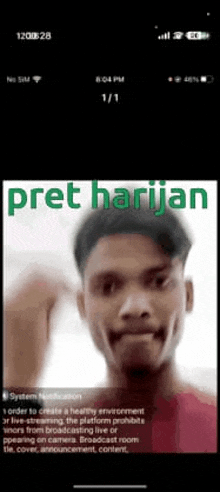 a phone screen shows a picture of a man with the words pret harijan on it .