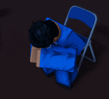 a person in a blue shirt is sitting in a chair