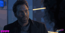 a man in a suit is looking at a woman in a room with the words vagabond queen written on the bottom
