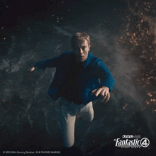 a poster for the fantastic four first steps shows a man in a blue shirt