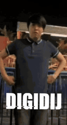 a man in a blue shirt is standing with his hands on his hips and the word digidij is on the bottom