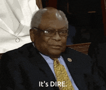 a man in a suit and tie says it 's dire .