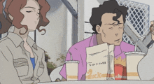 a man sits at a table with a bag that says duck