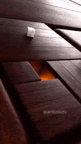 a picture of a wooden table with the hashtag artistoids on the bottom