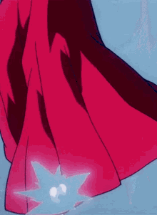 a close up of a person 's feet with a red coat on a blue background .