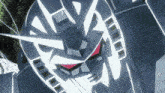 a close up of a robot head with red eyes