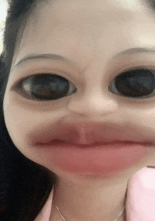 a close up of a woman 's face with big eyes and a pink lip