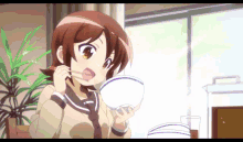 a girl in a school uniform is eating rice with chopsticks