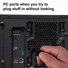 a person is plugging a usb cable into a computer port