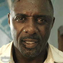 a close up of a man 's face with the words prime on the bottom
