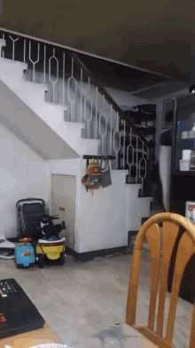 a room with stairs and a toy car that says ' disney cars ' on the side