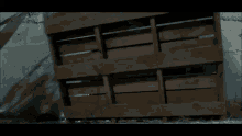 a blurry image of a person standing in front of a wall