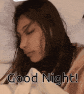 a woman is sleeping under a blanket with the words good night written on the bottom
