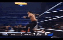 a wrestling match between roman reigns and kevin owens is going on