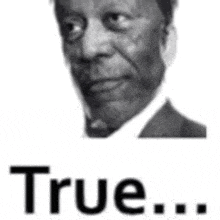 a black and white photo of a man in a suit and tie with the words `` true '' below him .
