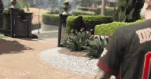 a man wearing a number 30 jersey is walking down a path