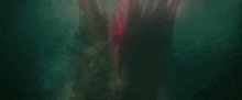 a close up of a monster 's eyes with glowing pink lights .
