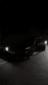 a black car with a sticker on the back window that says ' nsr ' on it