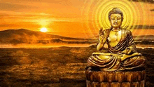 a statue of a buddha sitting on top of a lotus flower .