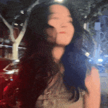 a blurry picture of a woman 's face with her eyes closed