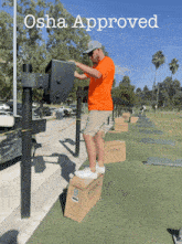 a man standing on a box with the words osha approved behind him
