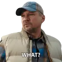 a man wearing a vest and a hat says " what "