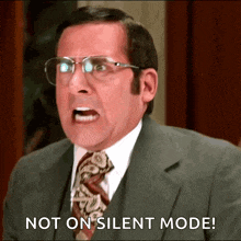 a man in a suit and tie is yelling and says not on silent mode