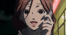 a cartoon girl is talking on a cell phone with a sign in the background that says ' a ' on it