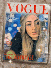 a vogue magazine with a picture of a girl on the cover