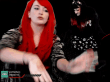 a woman with red hair is on a twitch stream